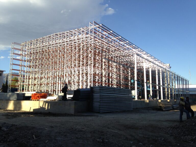 Warehouse retrofit underway, maintaining active logistics operations during the modernization of the structures.